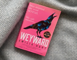 Black crow with pink background and the word Weyward underneath.
